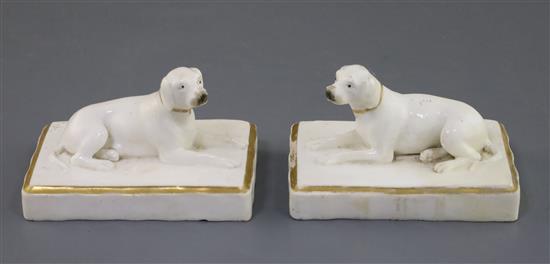 A pair of Rockingham porcelain figures of pointers, c.1830, L. 9.5cm, one restored